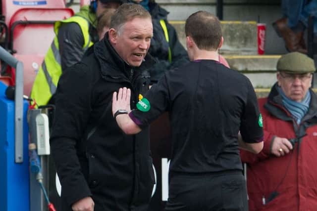John Hughes disagree's with referee Willie Collum in their quarter-final loss against Dundee Utd. Picture: SNS