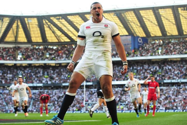 Luther Burrell celebrates after scoring England's second try against Wales. Picture: Shaun Botterill/Getty Images.