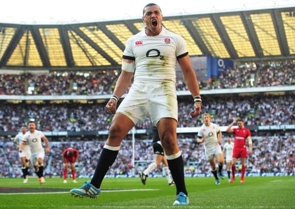 Luther Burrell celebrates after scoring England's second try against Wales. Picture: Shaun Botterill/Getty Images.