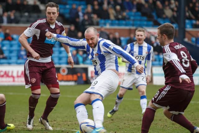 Striker Kirs Boyd smashing in Kilmarnock's third goal against Hearts. Picture: Steve Welsh