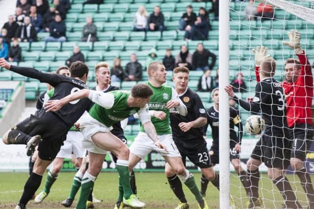 Hibs Michael Nelson squeezing the ball into the Motherwell net. Picture: Ian Georgeson.