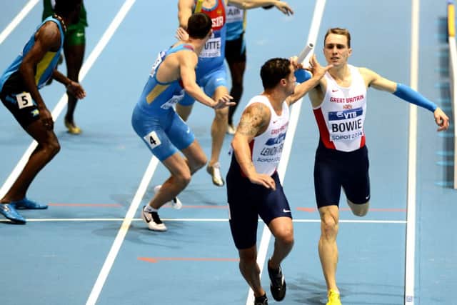 Jamie Bowie hands the baton to Luke LennonFord as Britain claimed silver in Poland. Picture: AFP/Getty