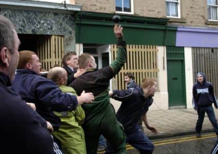 Jethart hand Ba, this ancient game has been played in the scottish borders town of Jedburgh for hundreds of years and is played once a year in the town centre, The Uppies and Doonies compete to see who can hail the Ball either to the top of the town or the bottom. Picture: Ian Rutherford