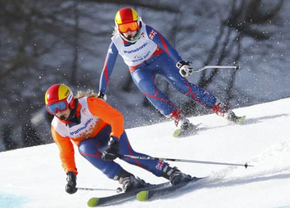 Kelly Gallagher, right, and her guide Charlotte Evans race to gold. Picture: AP