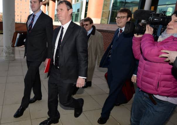 Nigel Evans, second from left, arrives at Preston Crown Court for the first day of his trial. Picture: Getty