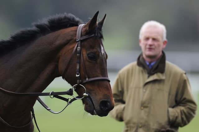 Trainer Willie Mullins watches Hurricane Fly on the gallops at Cheltenham. Picture: Getty