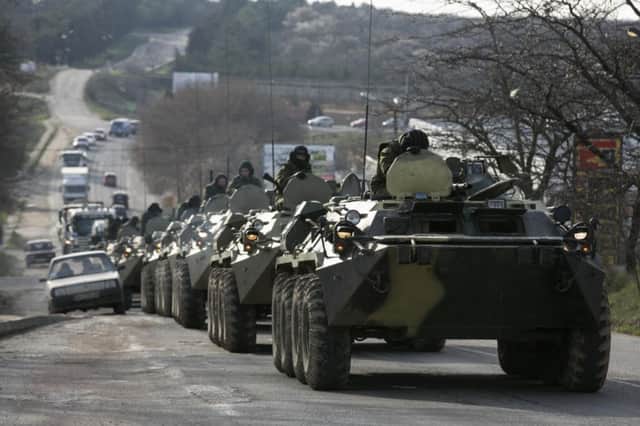 Soldiers, believed to be Russian, near Sevastopol yesterday. Picture: Reuters