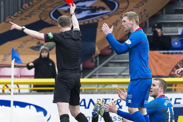 Marley Watkins, sitting, is red-carded for his tackle on Paul Paton on Sunday. Picture: SNS