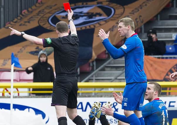 Marley Watkins, sitting, is red-carded for his tackle on Paul Paton on Sunday. Picture: SNS