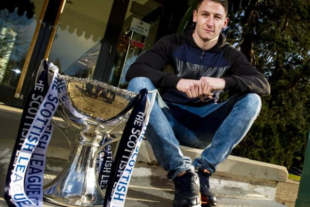 Josh Meekings with the Scottish League Cup. Picture: SNS