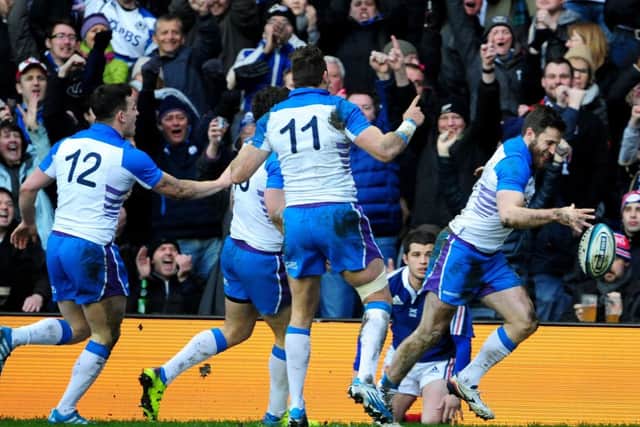 The Scottish backs celebrate Tommy Seymour's try against France. Picture: Ian Rutherford