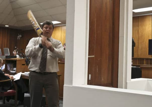 JG Vermeulen with the cricket bat in court yesterday. Picture: Reuters