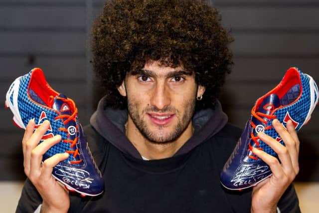 Manchester Utd's Marouane Fellaini visits Greaves Sports in Glasgow to promote his boots sponsors Warrior. Picture: SNS