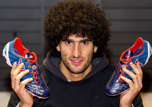 Manchester Utd's Marouane Fellaini visits Greaves Sports in Glasgow to promote his boots sponsors Warrior. Picture: SNS