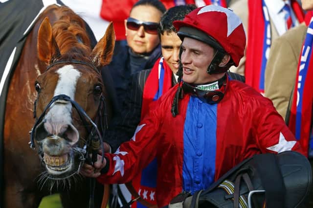Jamie Moore with Sire De Grugy after winning at Cheltenham. Picture: REUTERS/Eddie Keogh