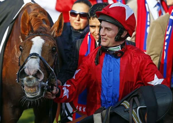 Jamie Moore with Sire De Grugy after winning at Cheltenham. Picture: REUTERS/Eddie Keogh