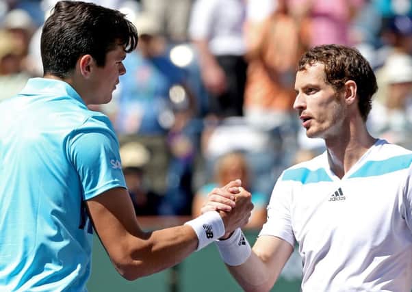 Milos Roanic is congratulated by Andy Murray  after their match during the BNP Parabas Open at the Indian Wells Tennis Garden. Picture: Getty