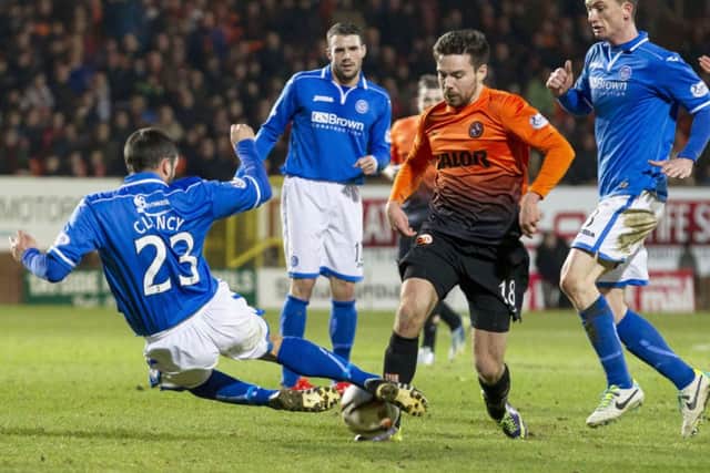 St Johnstone's Tim Clancy (left) battles with Ryan Dow. Picture: SNS