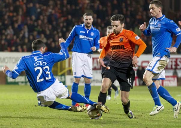 St Johnstone's Tim Clancy (left) battles with Ryan Dow. Picture: SNS