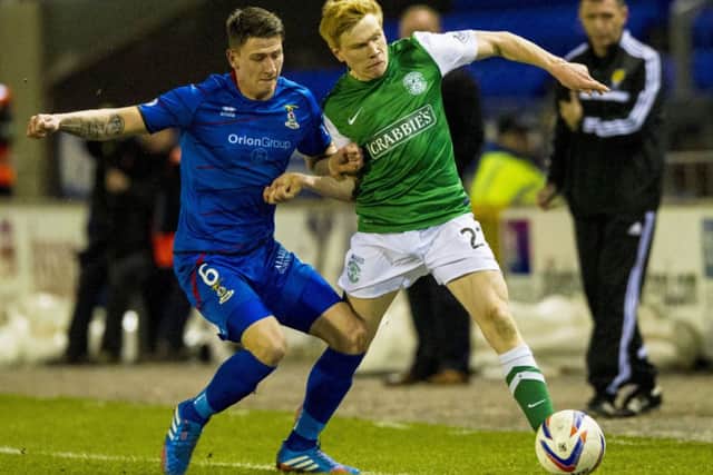 Inverness' Josh Meekings (left) battles with Duncan Watmore. Picture: SNS