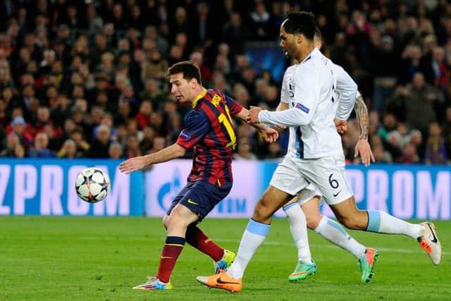 Man City defender Joleon Lescott cant prevent Lionel Messi from opening the scoring. Picture: Getty