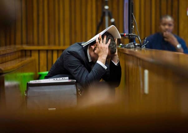 Pistorious holds his head in his hands in court Picture:Getty