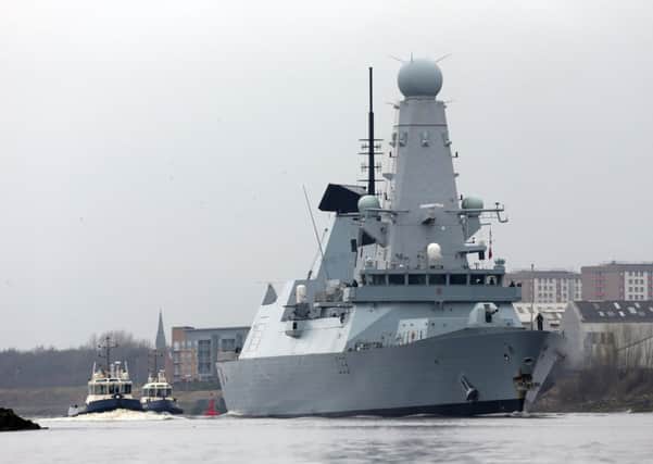 HMS Dauntless sails down the Clyde. Picture: Ian MacNicol