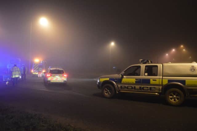 Police man a road block in Gillingham, near Beccles, Norfolk. Picture: PA