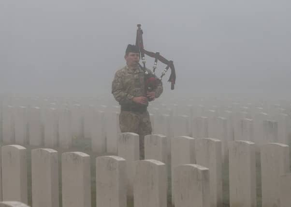 Corporal Stuart Gillies of The 2nd Battalion The Royal Regiment of Scotland in Loos British Cemetery. Picture: Getty