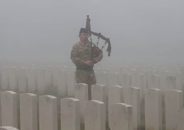 Corporal Stuart Gillies of The 2nd Battalion The Royal Regiment of Scotland in Loos British Cemetery. Picture: Getty