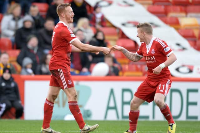 Jonny Hayes, right, celebrates a goal with Adam Rooney. Picture: SNS