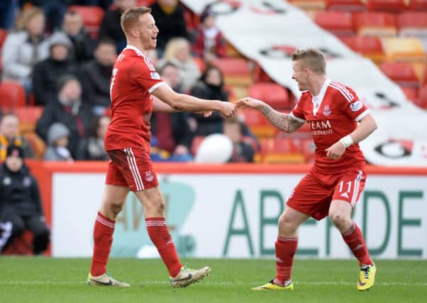 Jonny Hayes, right, celebrates a goal with Adam Rooney. Picture: SNS