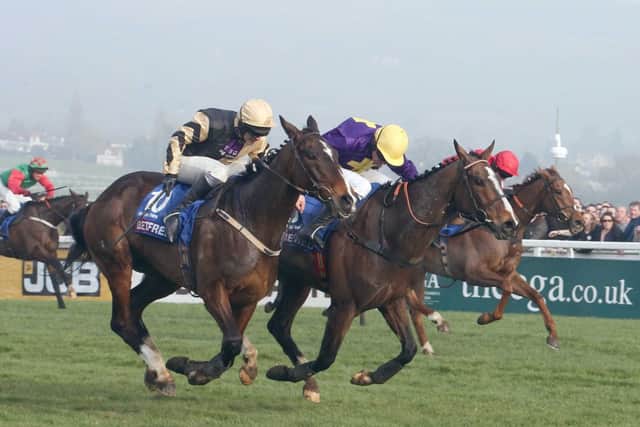 Lord Windermere and Davy Russell, purple silks, clinch victory in the Cheltenham Gold Cup. Picture: John Grossick