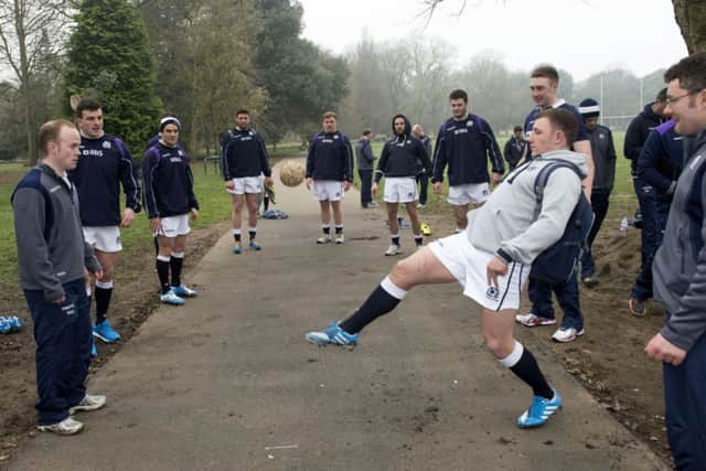 Duncan Weir gets involved as the Scotland squad indulge in a spot of keepie-uppie. Picture: SNS