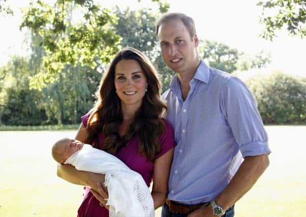 BUCKLEBURY, BERKSHIRE - AUGUST 2013:  (EDITORIAL USE ONLY - NO SALES) In this handout image provided by Kensington Palace, Catherine, Duchess of Cambridge and Prince William, Duke of Cambridge pose for a photograph with their son, Prince George Alexander Louis of Cambridge in the garden of the Middleton family home in August 2013 in Bucklebury, Berkshire.  (Photo by Michael Middleton/Kensington Palace via Getty Images)