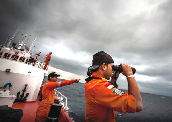Indonesian national search and rescue agency personel search for MH370. Picture: Getty