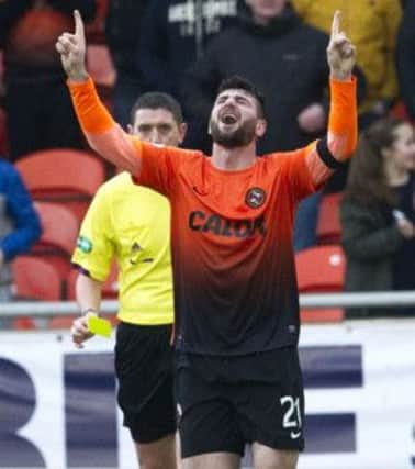 Nadir Ciftci celebrates after scoring a dramatic late winner for Dundee Utd. Picture: SNS