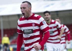 Darian MacKinnon races off to celebrate. Picture: SNS
