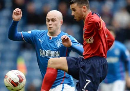 Nicky Law puts pressure on Liam Cusack during the draw with Albion Rovers. Picture: SNS