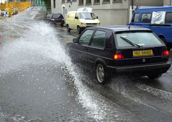 Accelerating through puddles and splashing pedestrians could result in a fine. Picture: Evening News