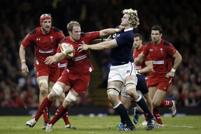Wales lock Alun Wyn Jones fends off Scotlands Richie Gray. Picture: Getty Images