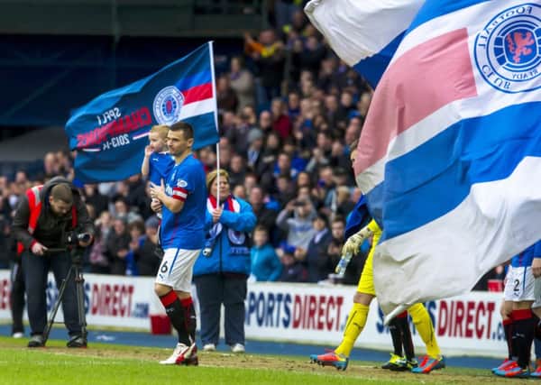 Lee McCulloch leads his team on to the Ibrox pitch after clinching the League 1 title. Picture: SNS