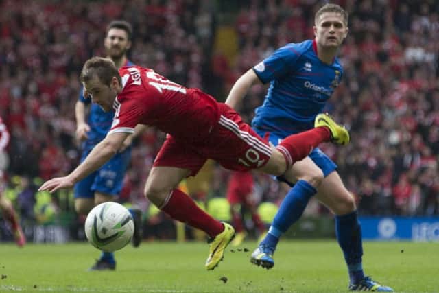 Aberdeen's Niall McGinn (left) and Inverness' James Vincent during the Scottish League Cup final. Picture: PA