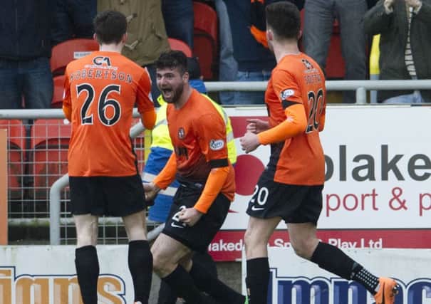 Nadir Ciftci, centre, shows his delight after his stoppage-time winner. Picture: SNS