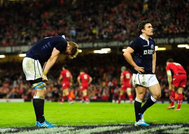 David Denton and Max Evans of Scotland  look on dejectedly after a Wales try. Picture: Getty