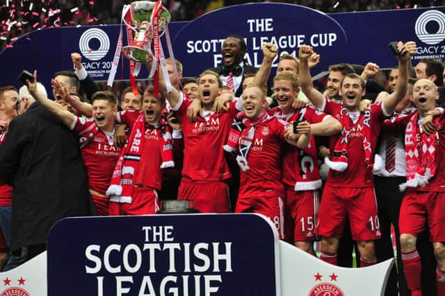 Aberdeen celebrate their Scottish League Cup victory against Inverness. Picture: Robert Perry