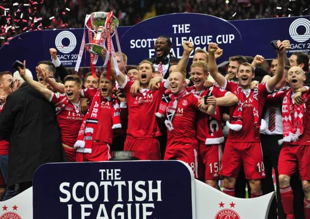 Aberdeen celebrate their Scottish League Cup victory against Inverness. Picture: Robert Perry