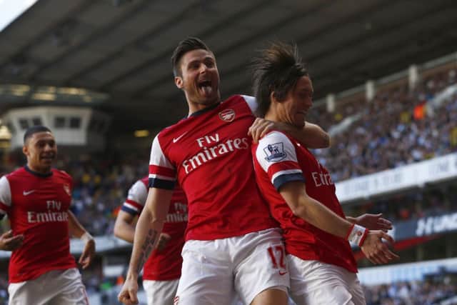 Tomas Rosicky, right, celebrates his magnificent winner with Olivier Giroud. Picture: PA