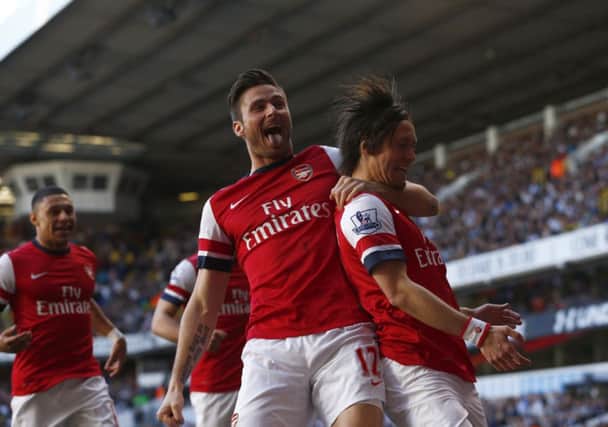 Tomas Rosicky, right, celebrates his magnificent winner with Olivier Giroud. Picture: PA