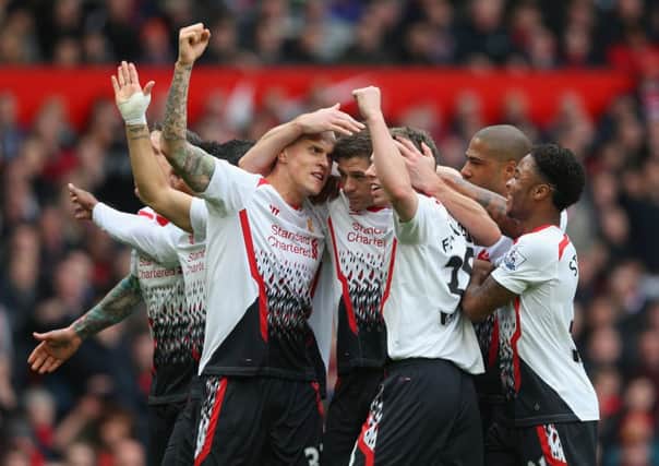 Liverpool ran riot consigning David Moyes United to a humiliating 3-0 home defeat. Picture: Getty